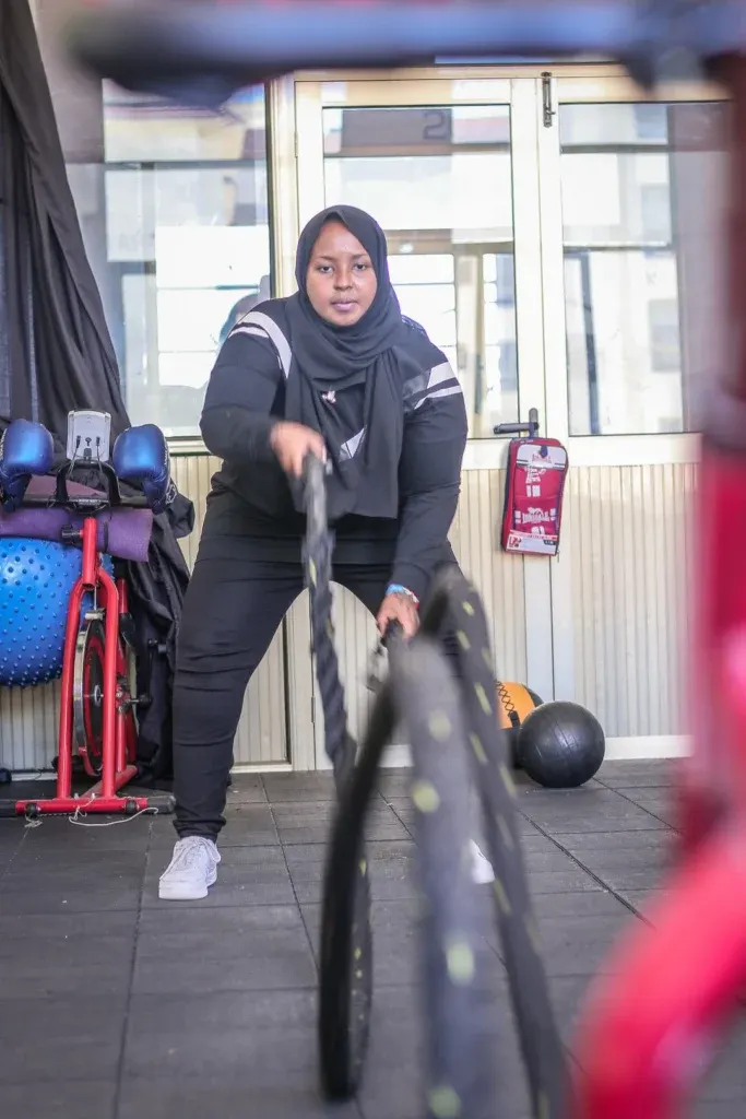 A JFS member training with battle ropes