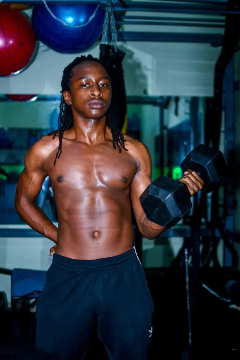 A JFS member training with dumbbells