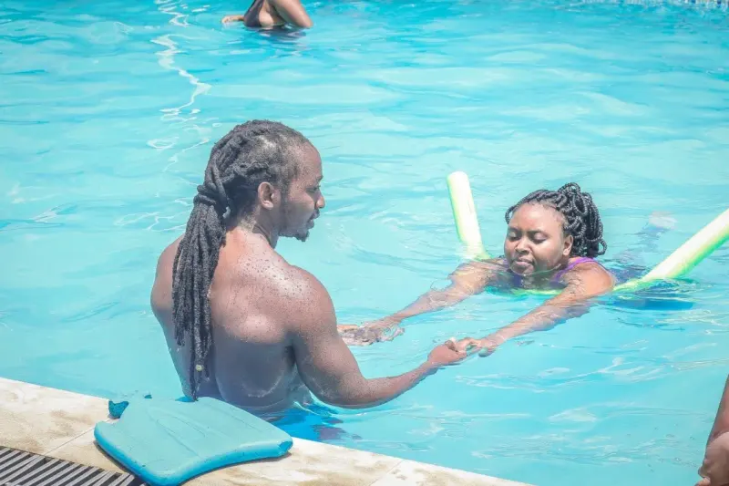 A JFS coach teaching a swimming lesson